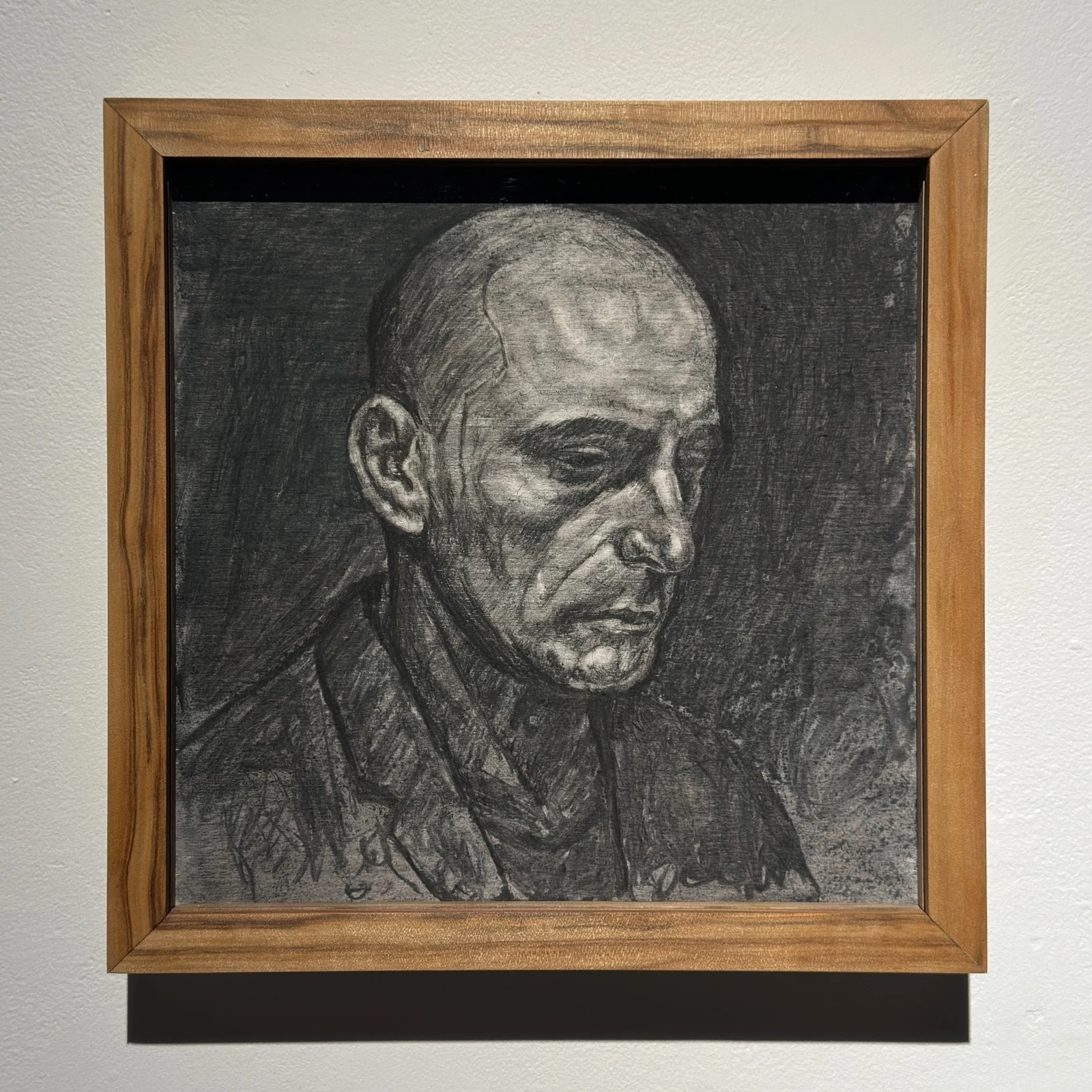 Framed charcoal portrait from Lucid: A Portrait in Phases looking upward