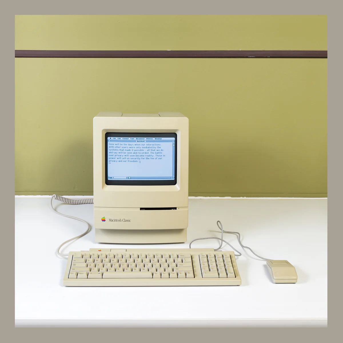 Macintosh Classic computer photographed frontally