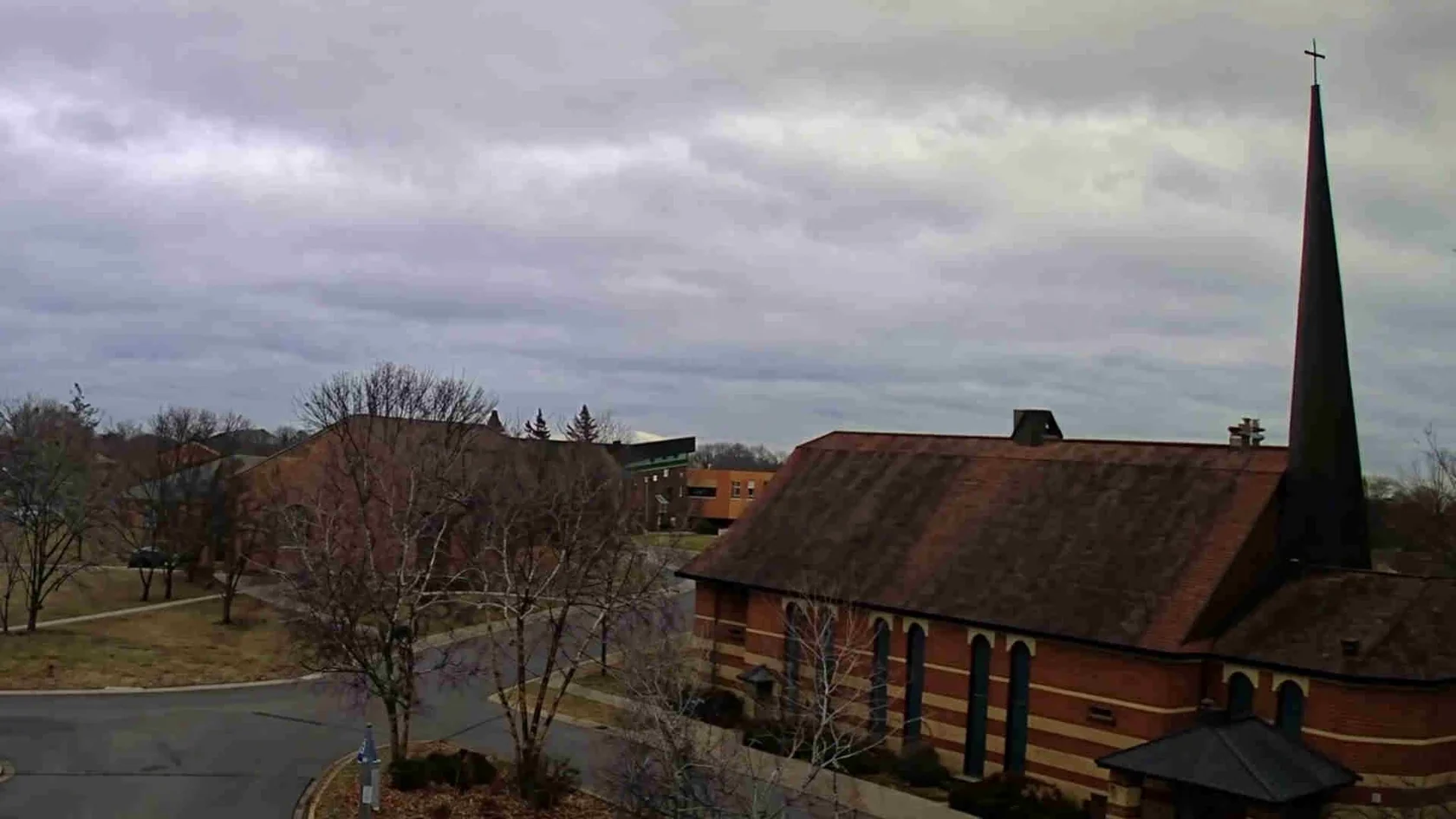 Church and roadway seen through surveillance-style video